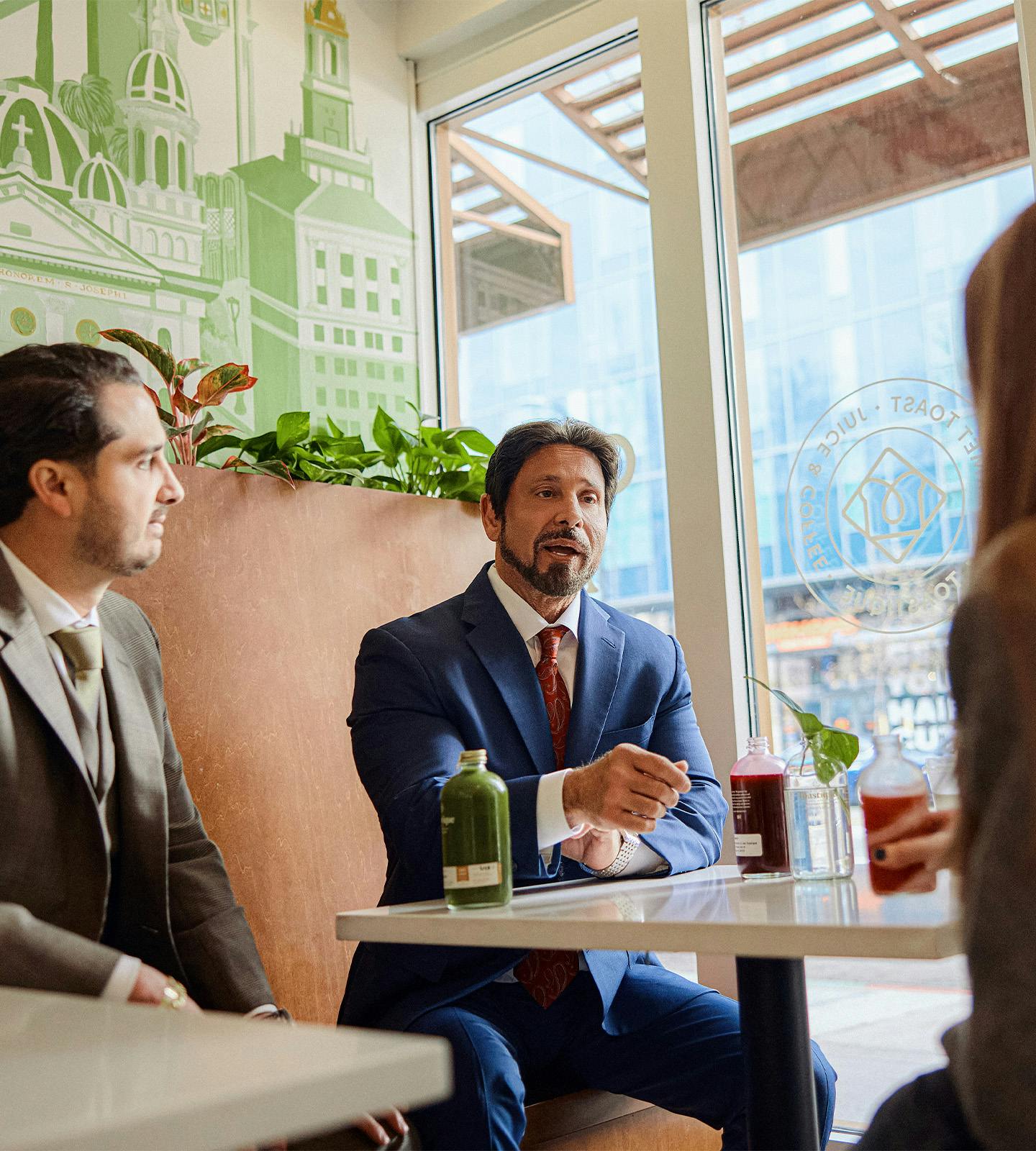 two attorneys talking to a client
