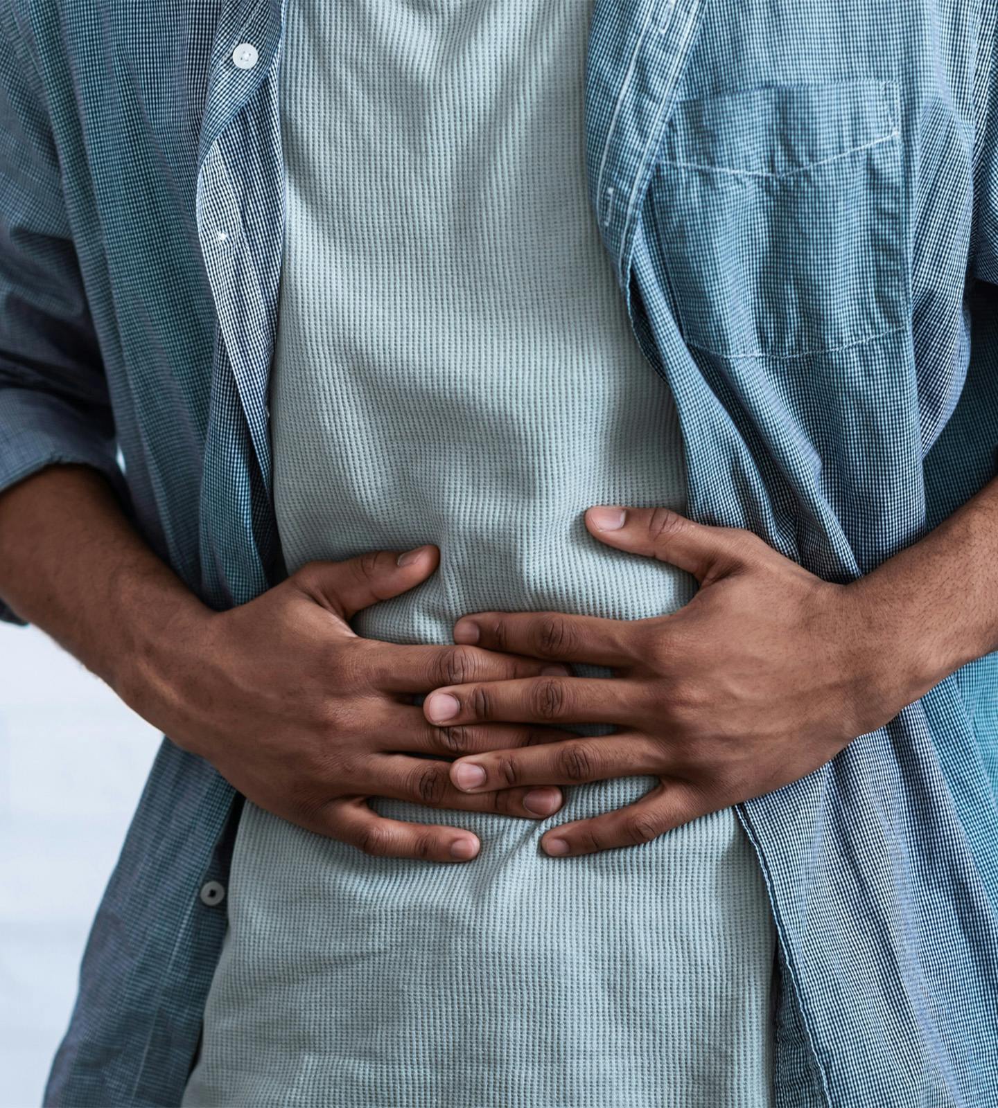 A person holding thier stomach