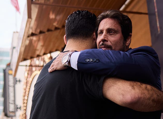 Omar Habbas hugging man
