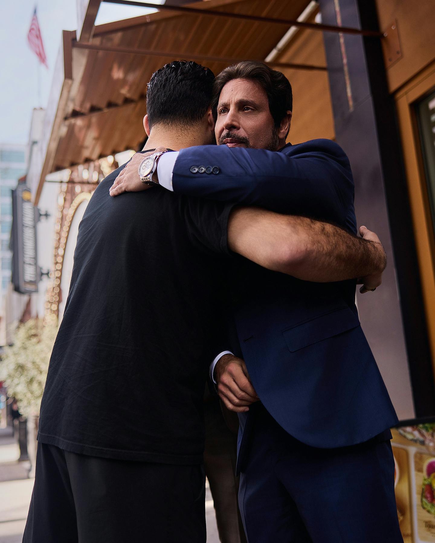 Habbas hugging a client