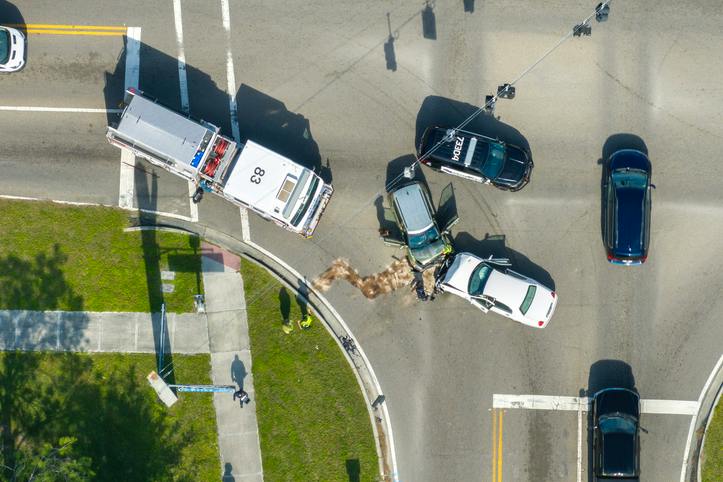 car accident in intersection with emergency responders