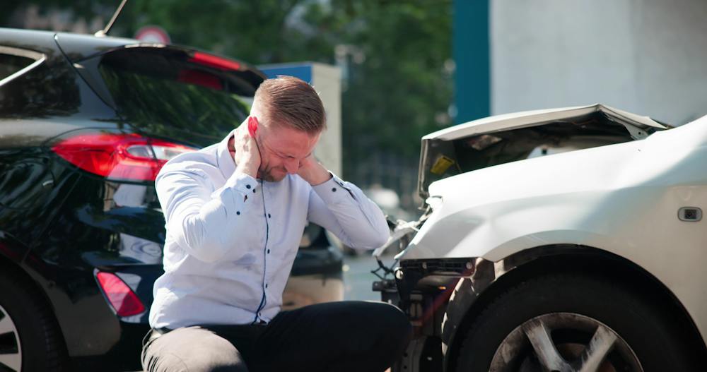 Person involved in a car accident suffering from whiplash