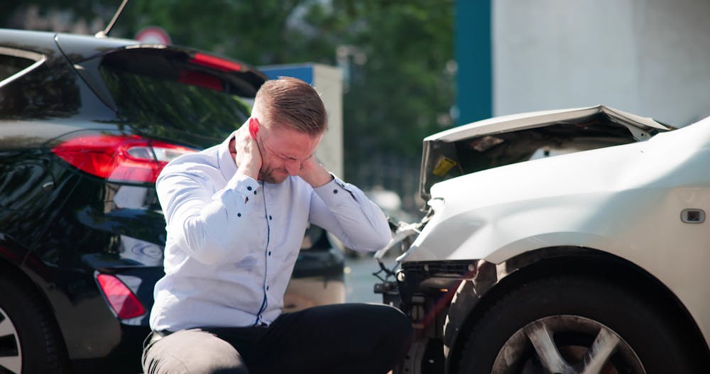 Person involved in a car accident suffering from whiplash