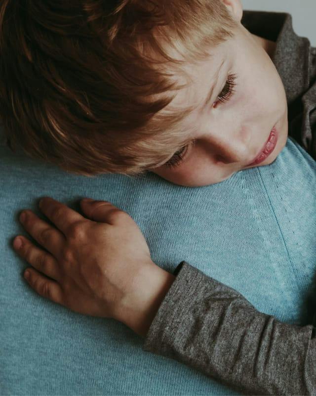 child hugging parent