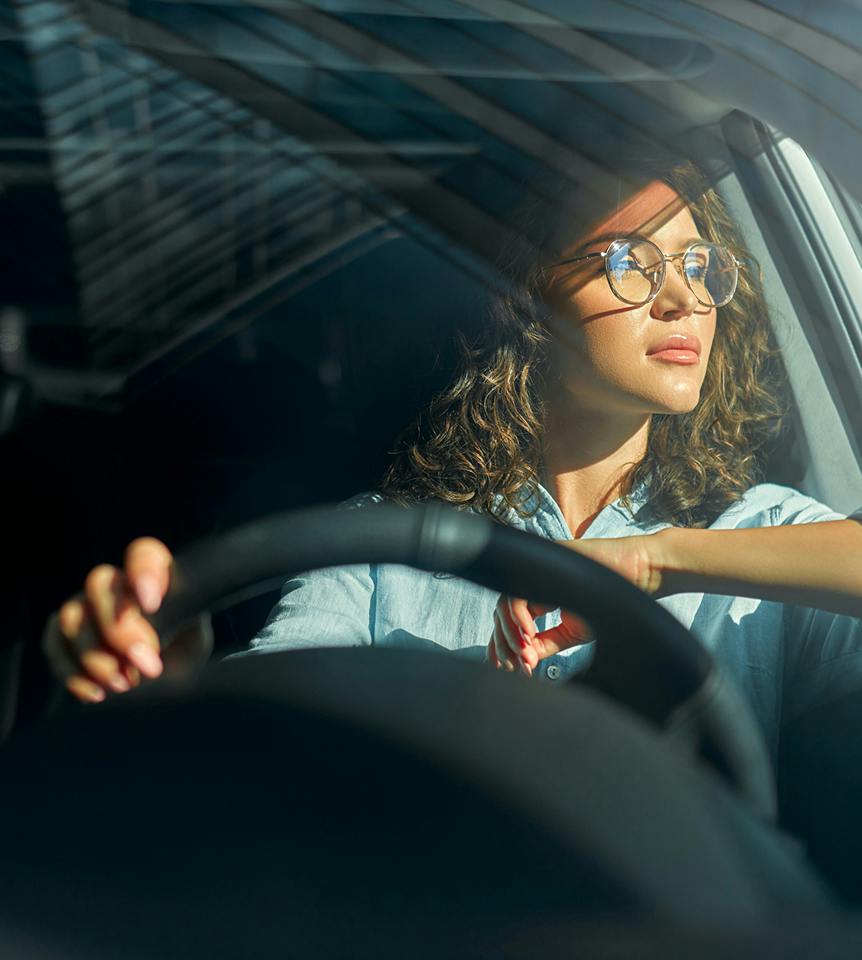 woman looking out the car window