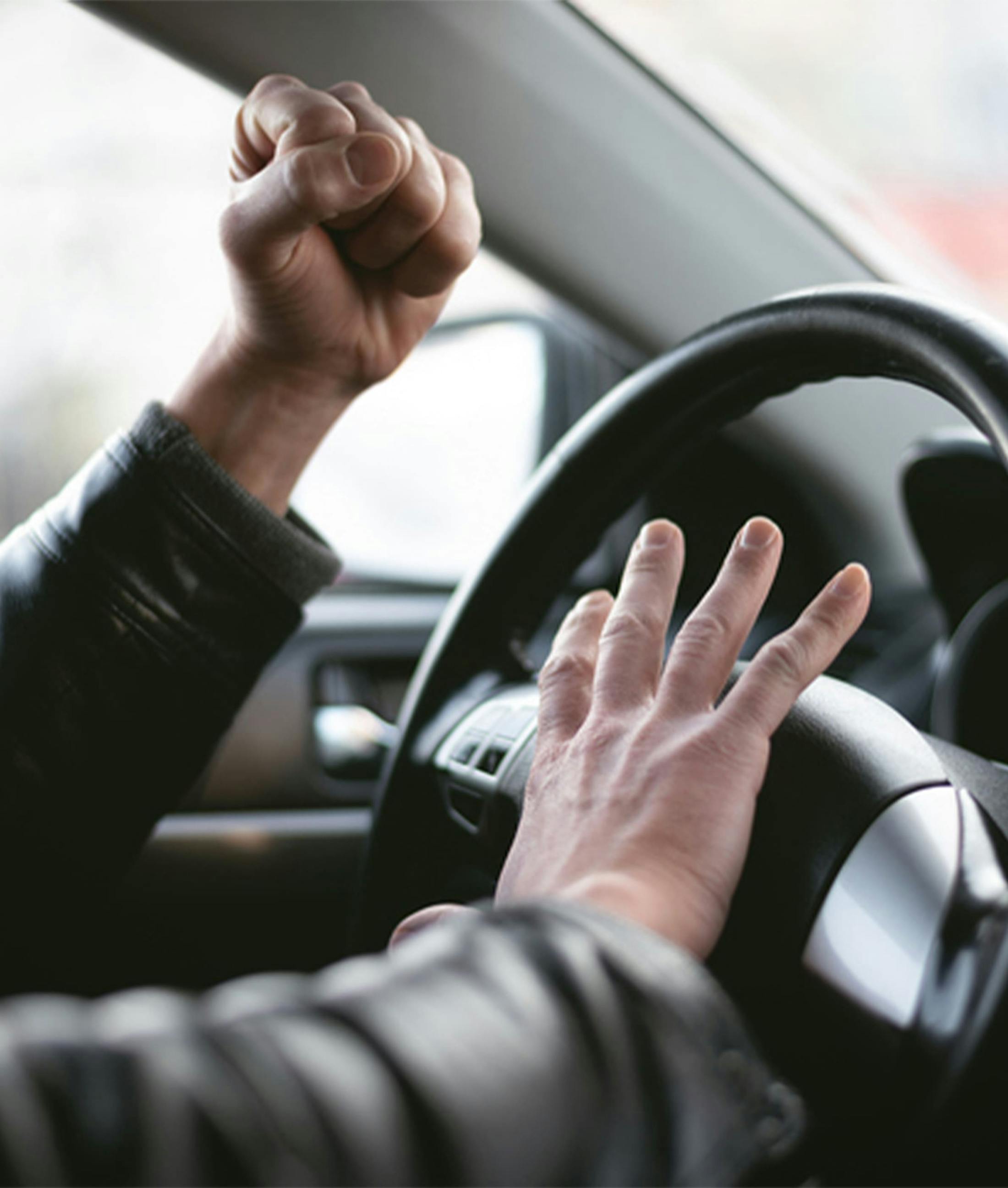 hand on steering wheel