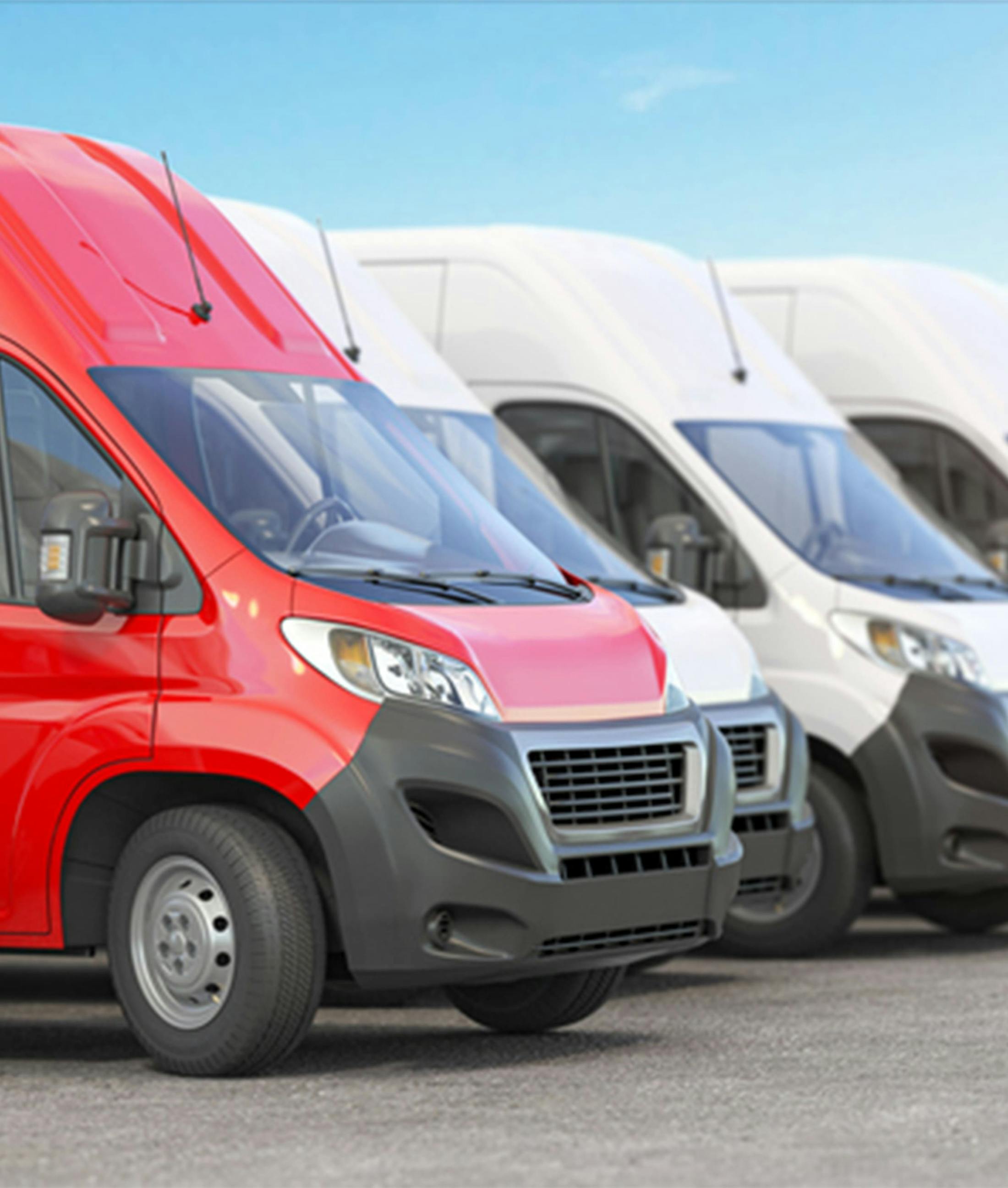 four vans lined up next to each other