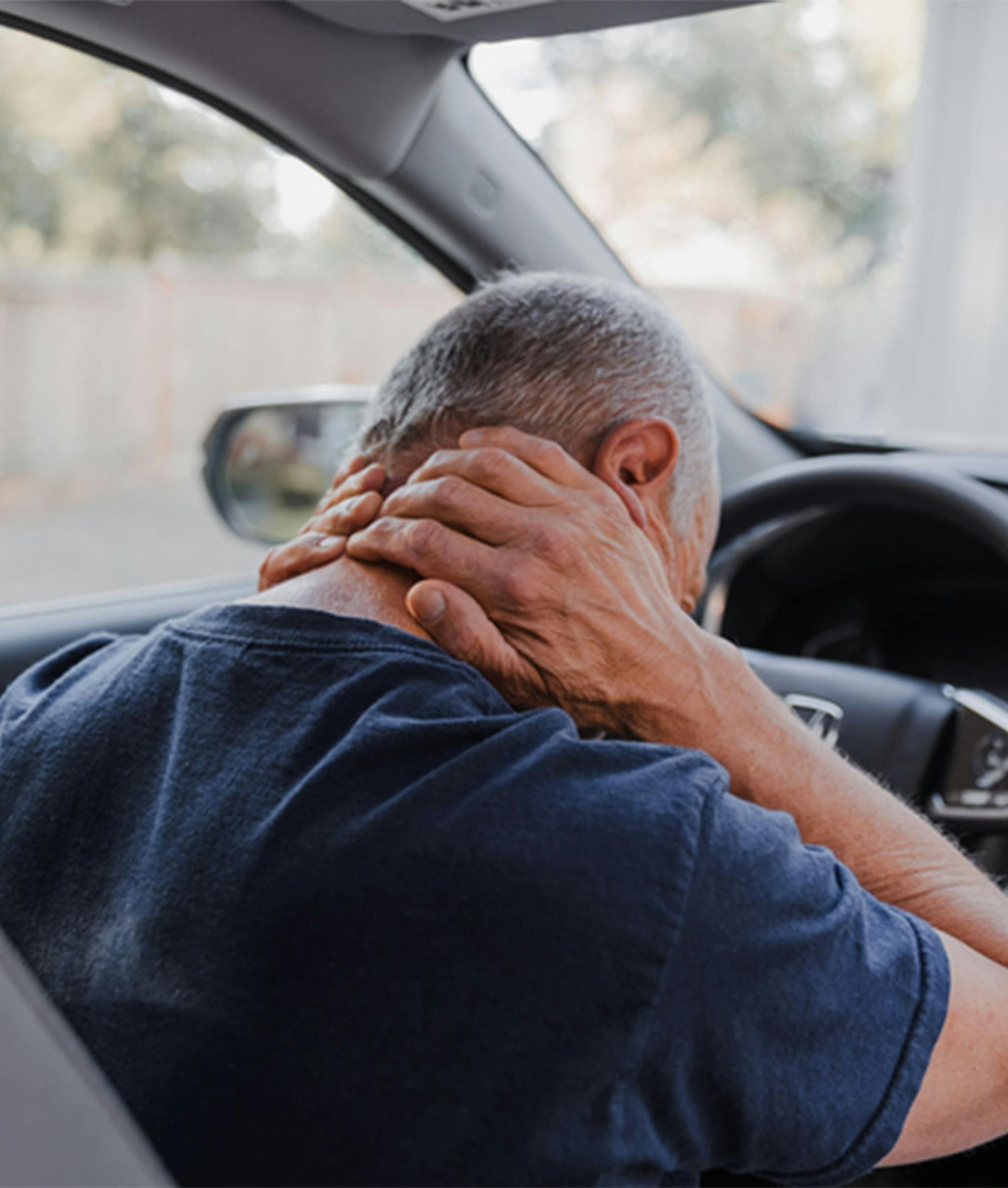 man holding his neck