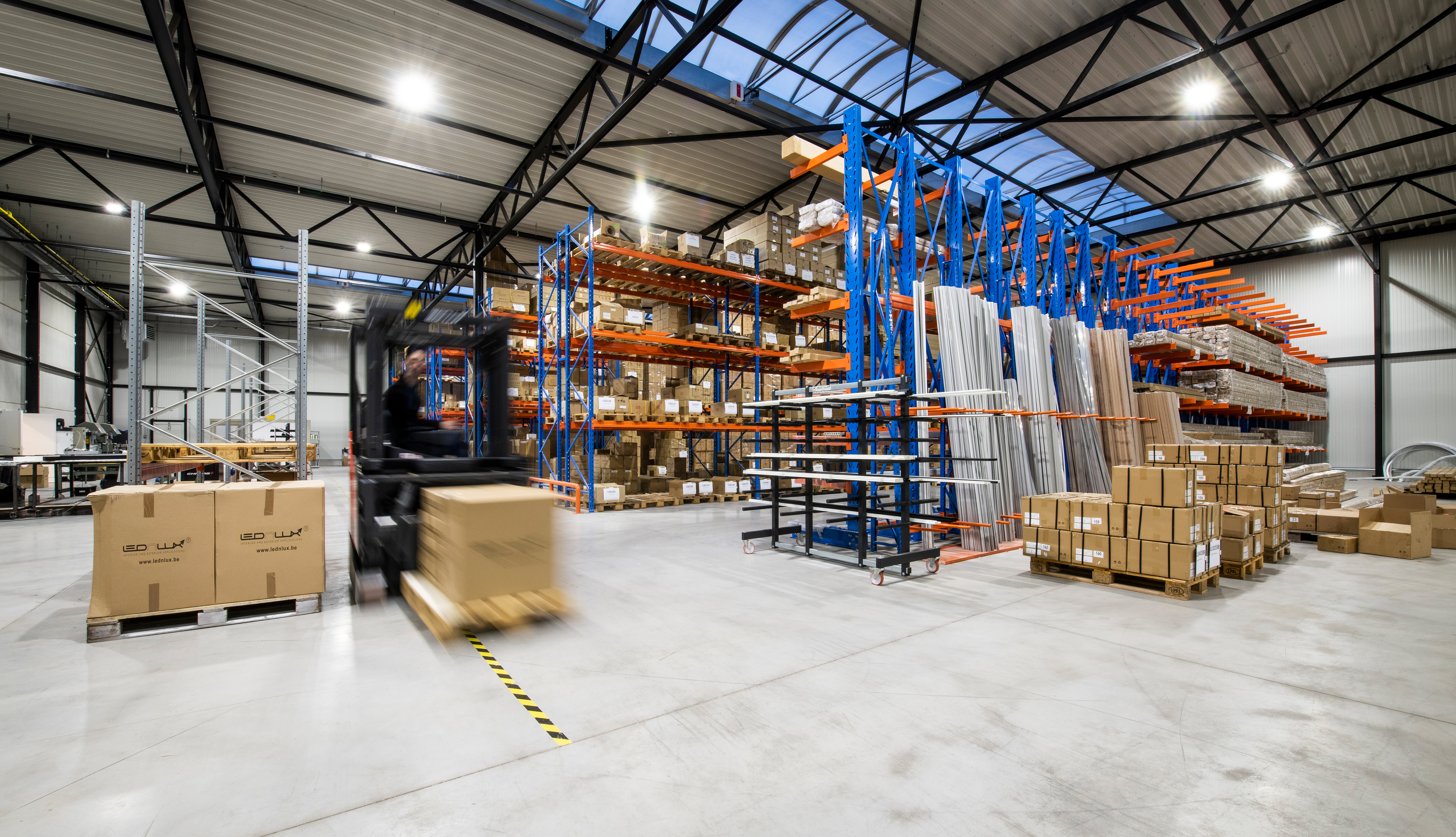 Forklift moving a pallet through a warehouse