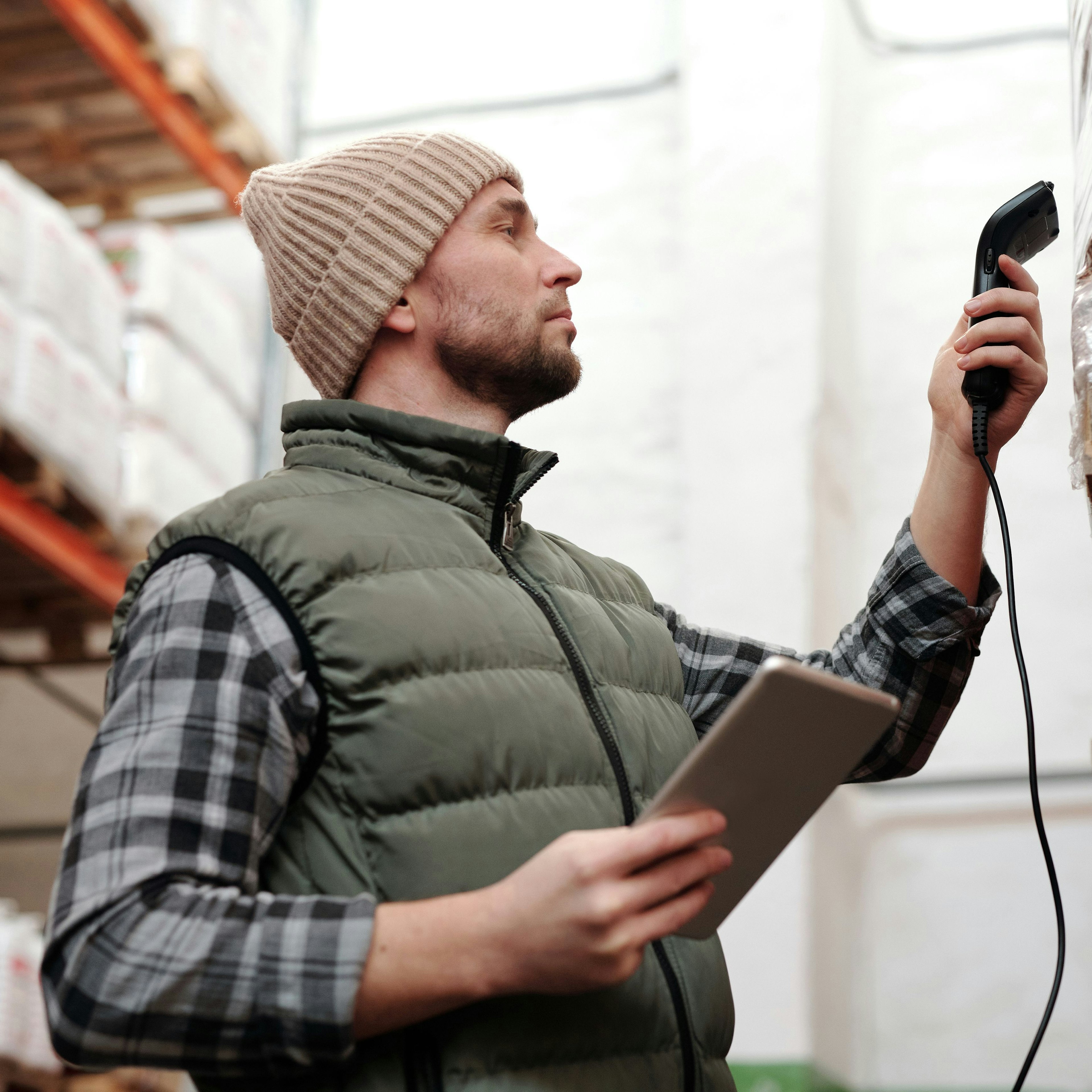 Warehouse worker scanning a barcode with a tablet