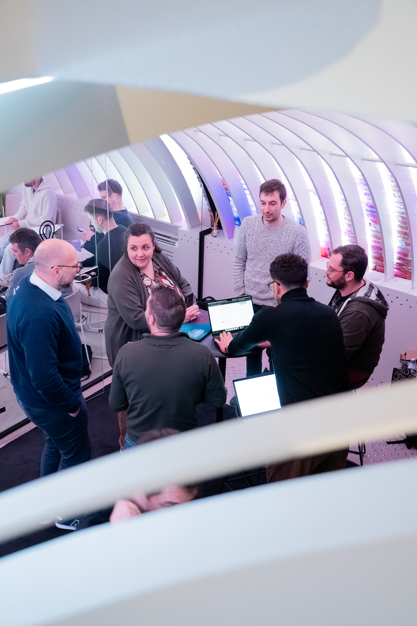 Group working on laptops at a networking event