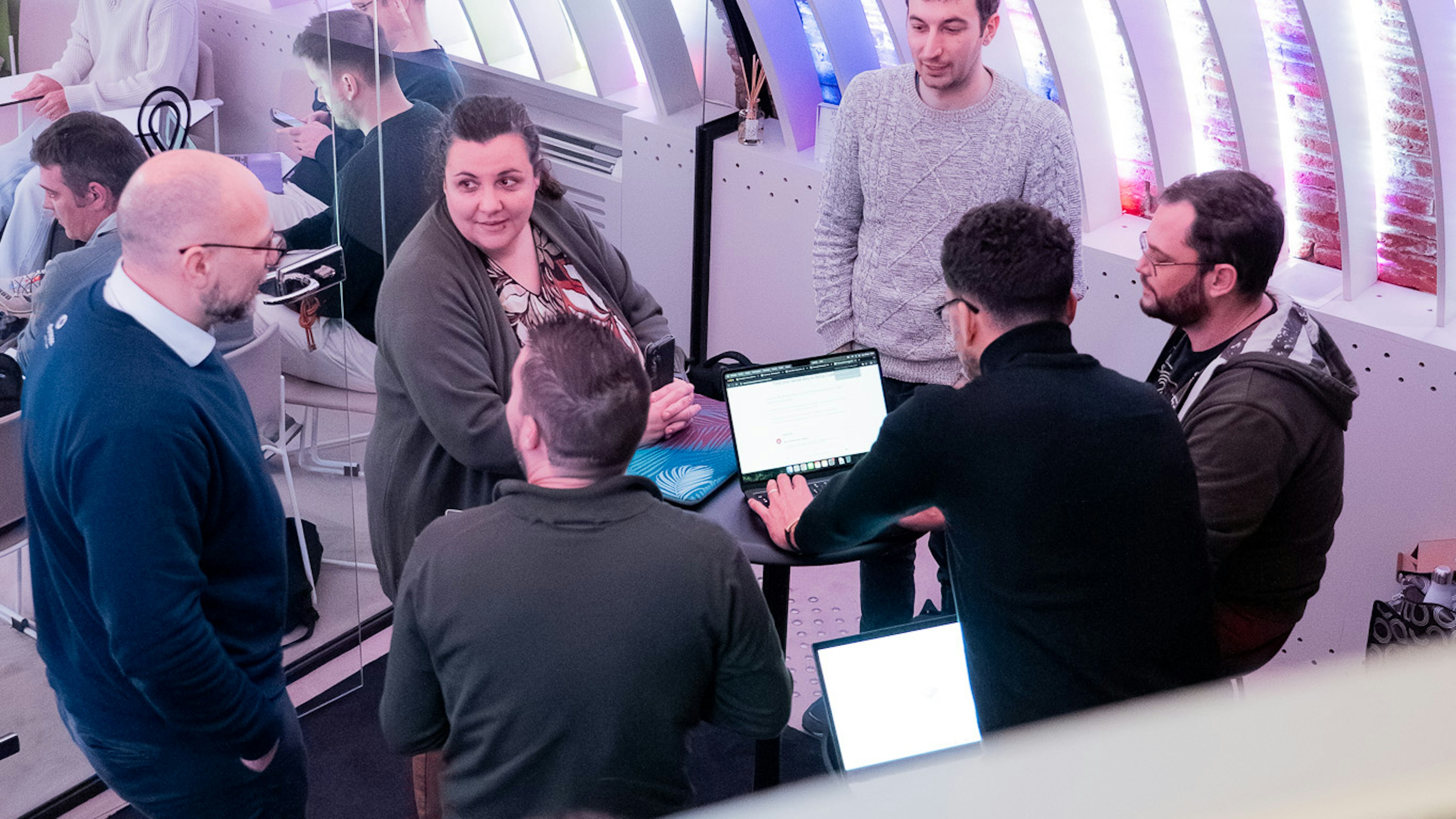 Group working on laptops at a networking event