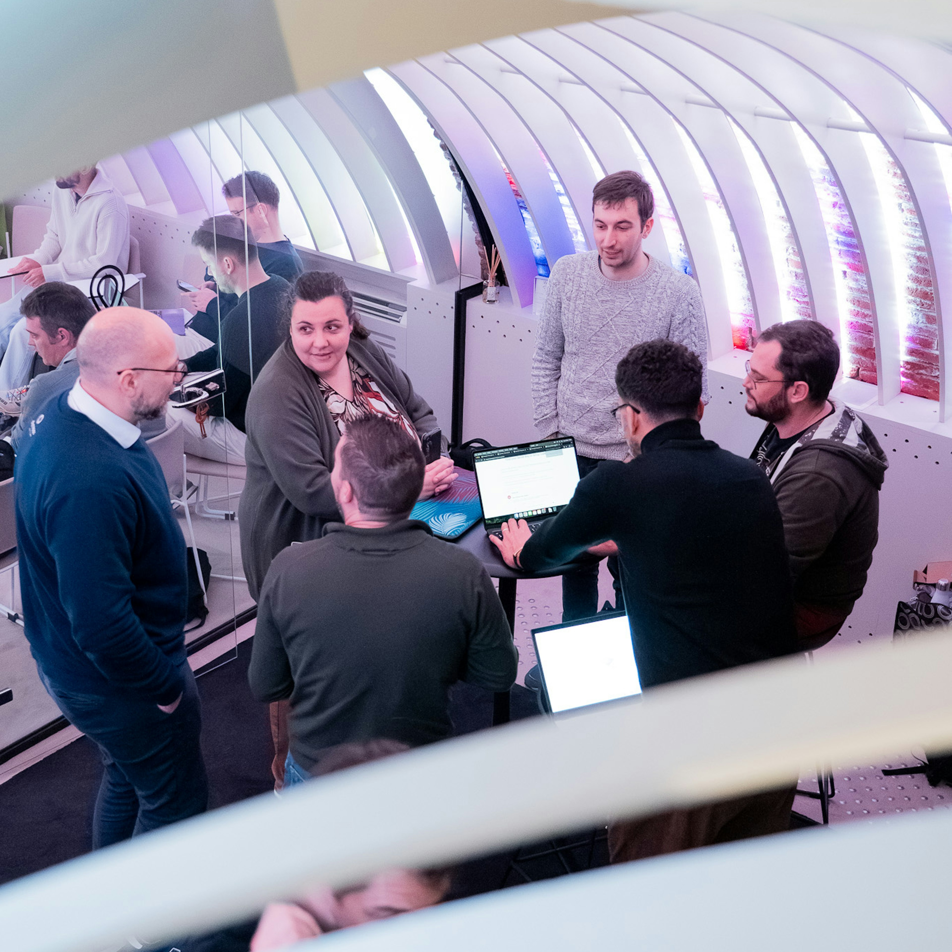Group working on laptops at a networking event