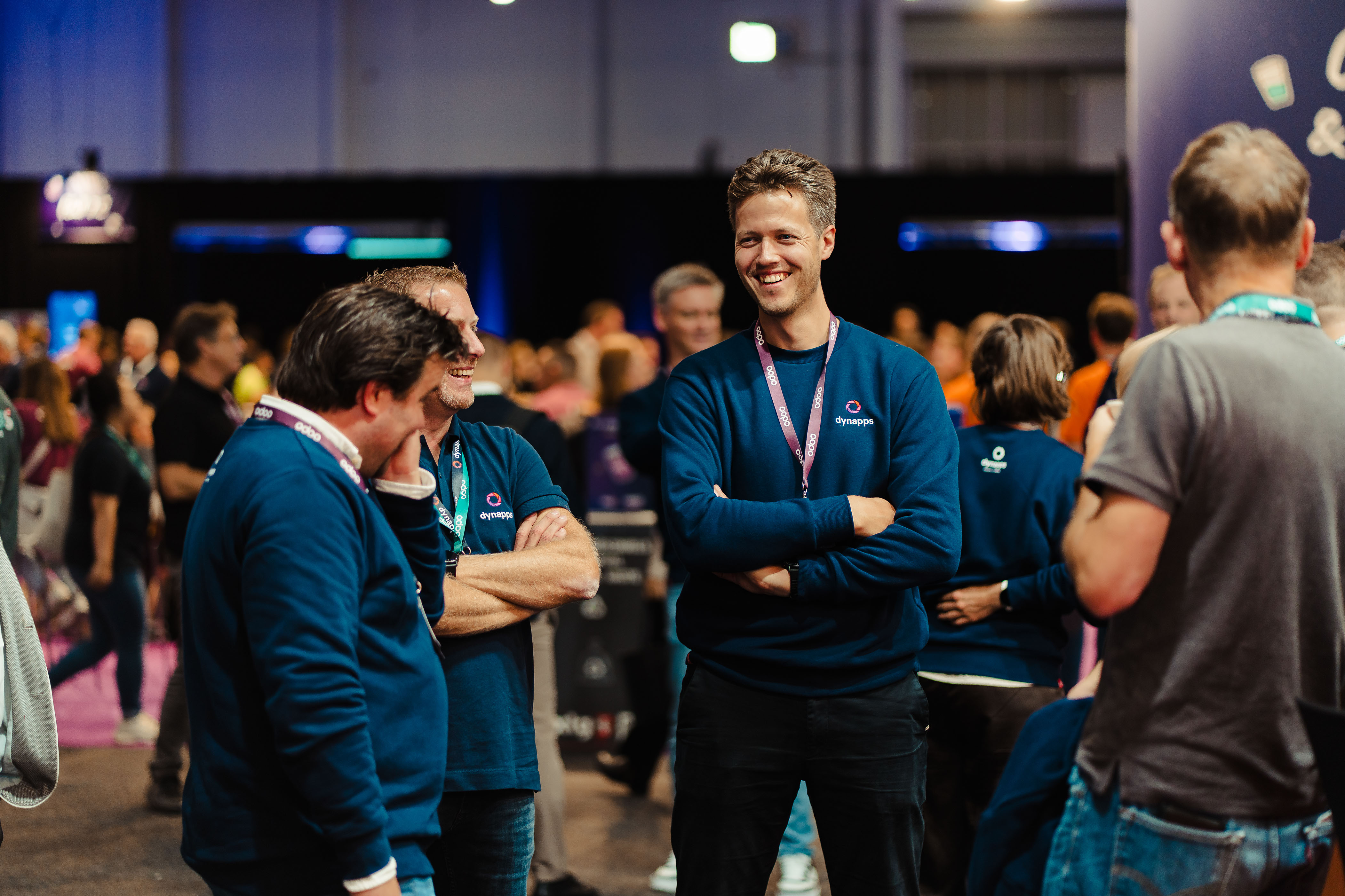 Dynapps colleagues laughing at an Odoo event