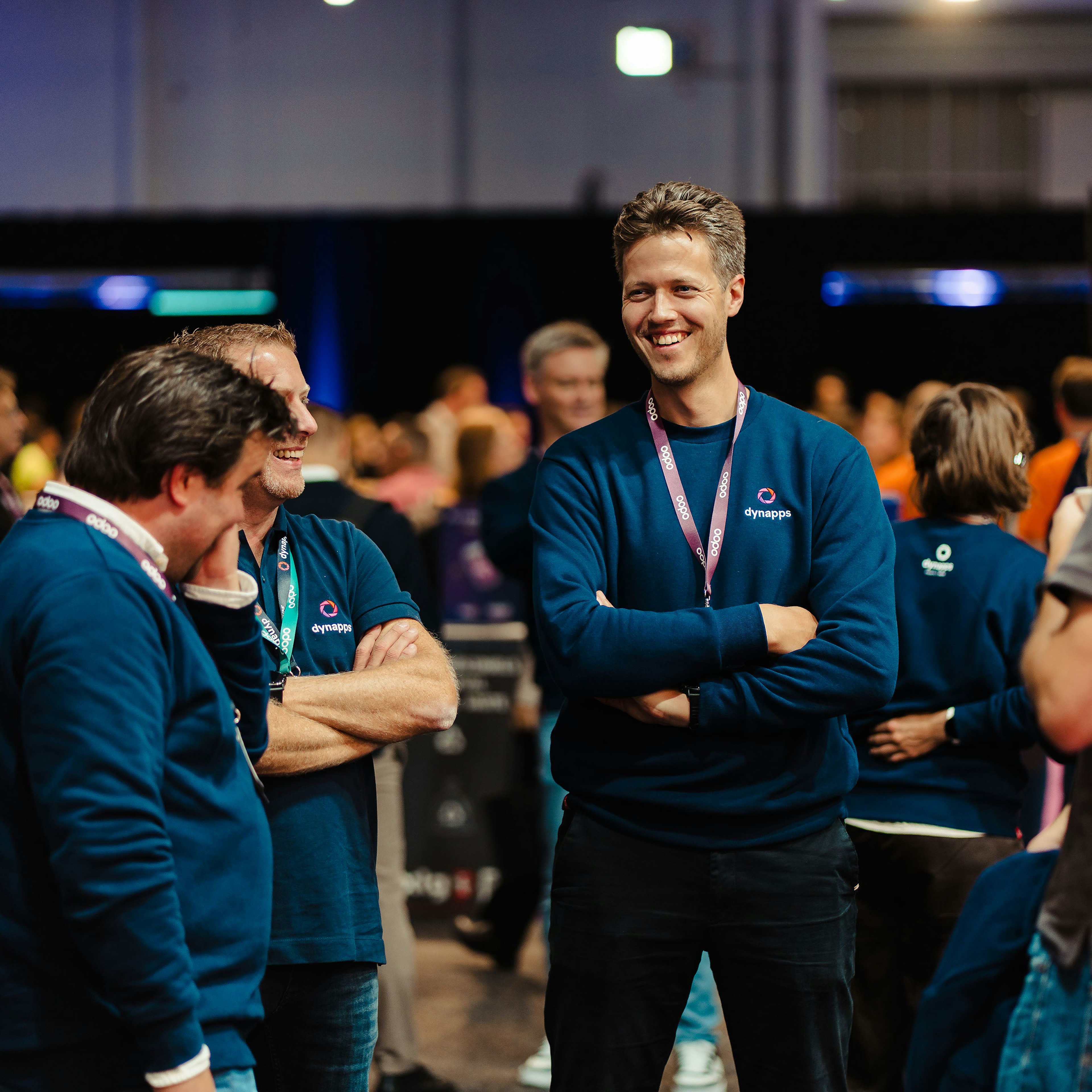 Dynapps colleagues laughing at an Odoo event