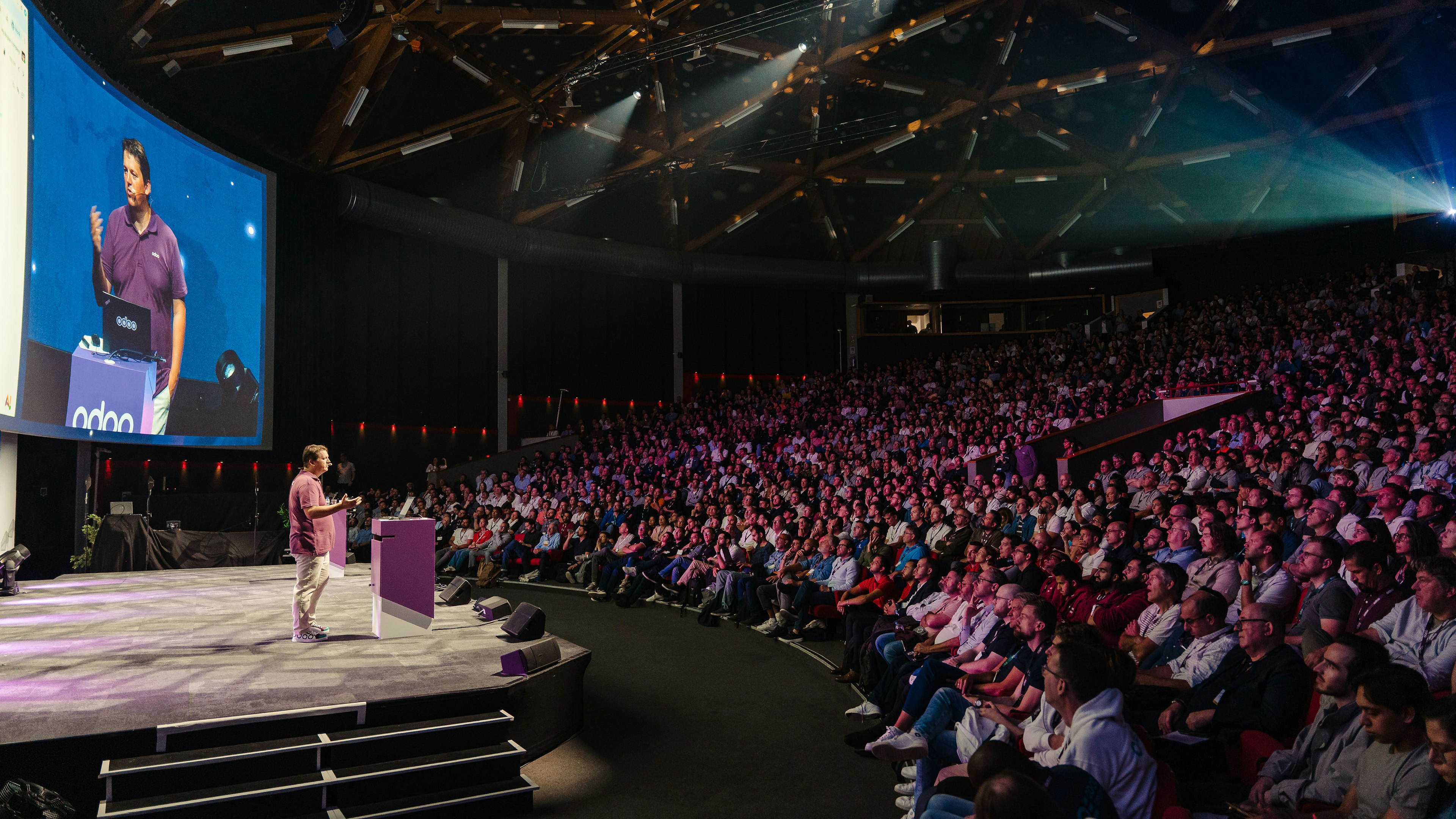Crowded auditorium watching the Odoo Experience keynote
