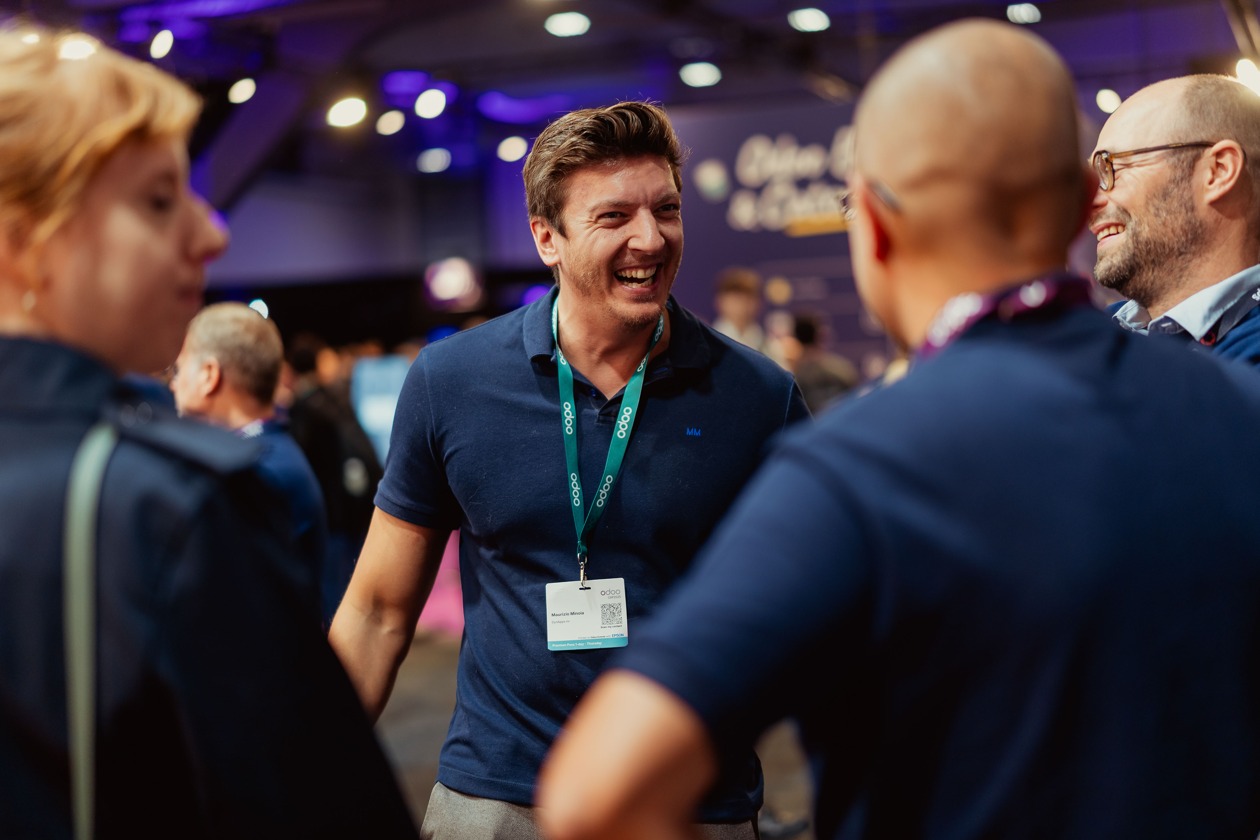 Attendees laughing together at the Odoo Experience fair