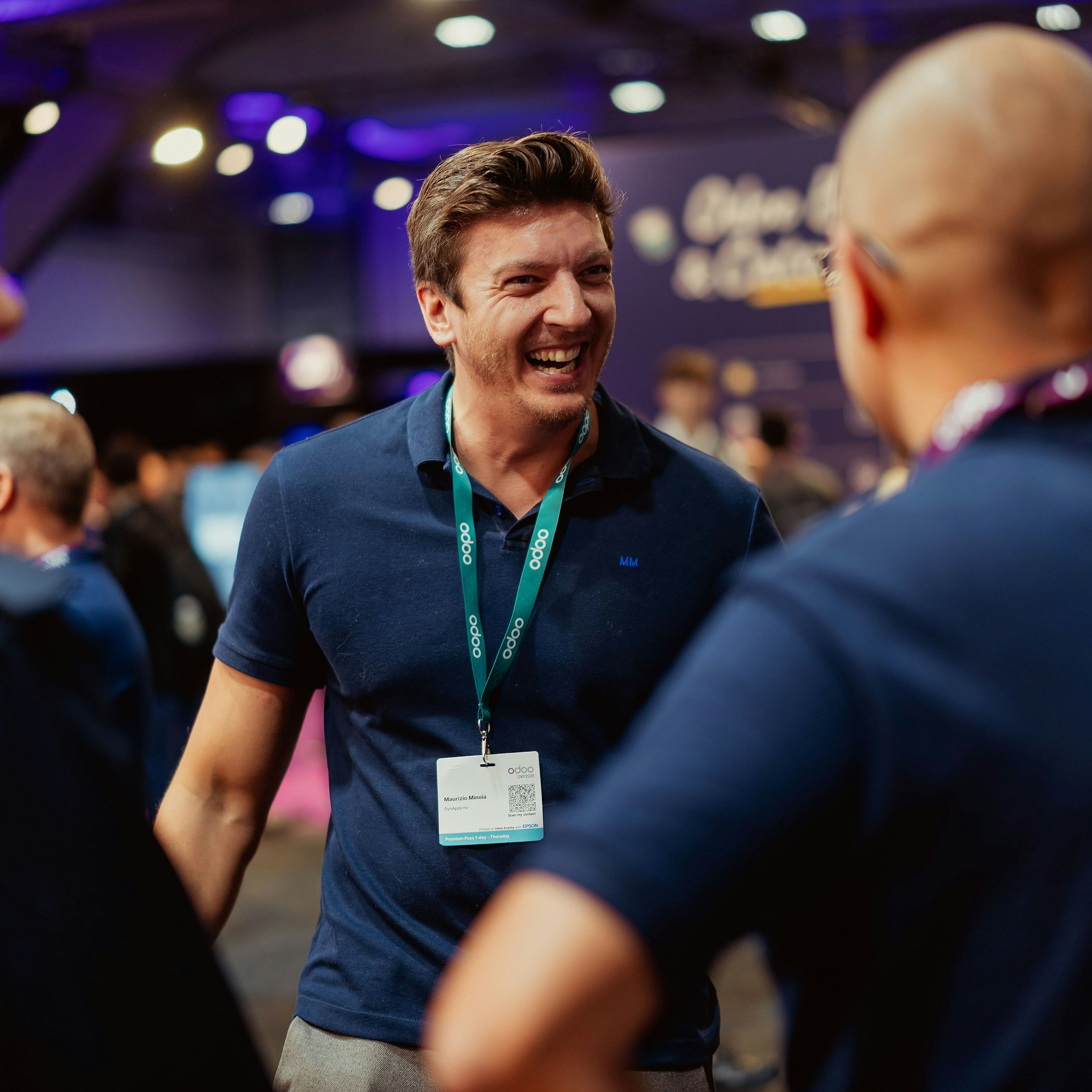 Attendees laughing together at the Odoo Experience fair