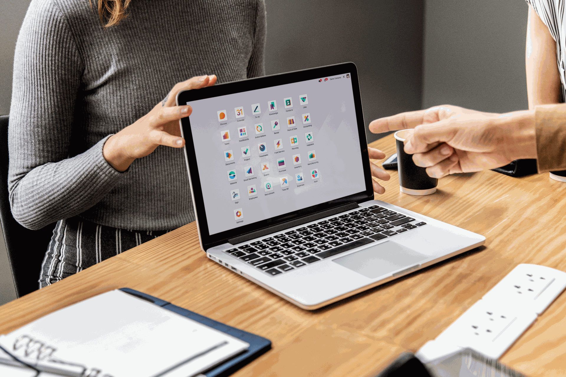 guy showing odoo apps to a girl