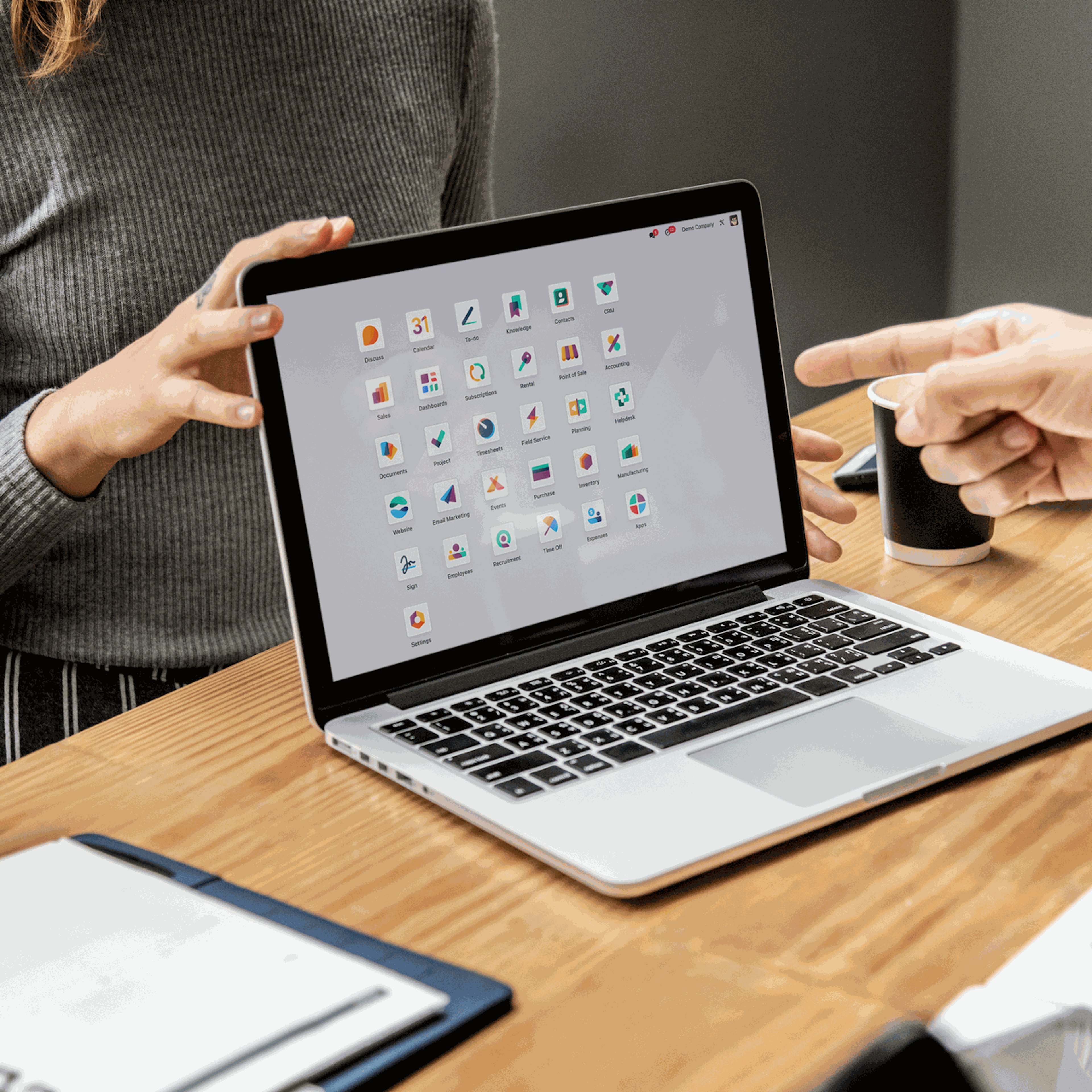 guy showing odoo apps to a girl