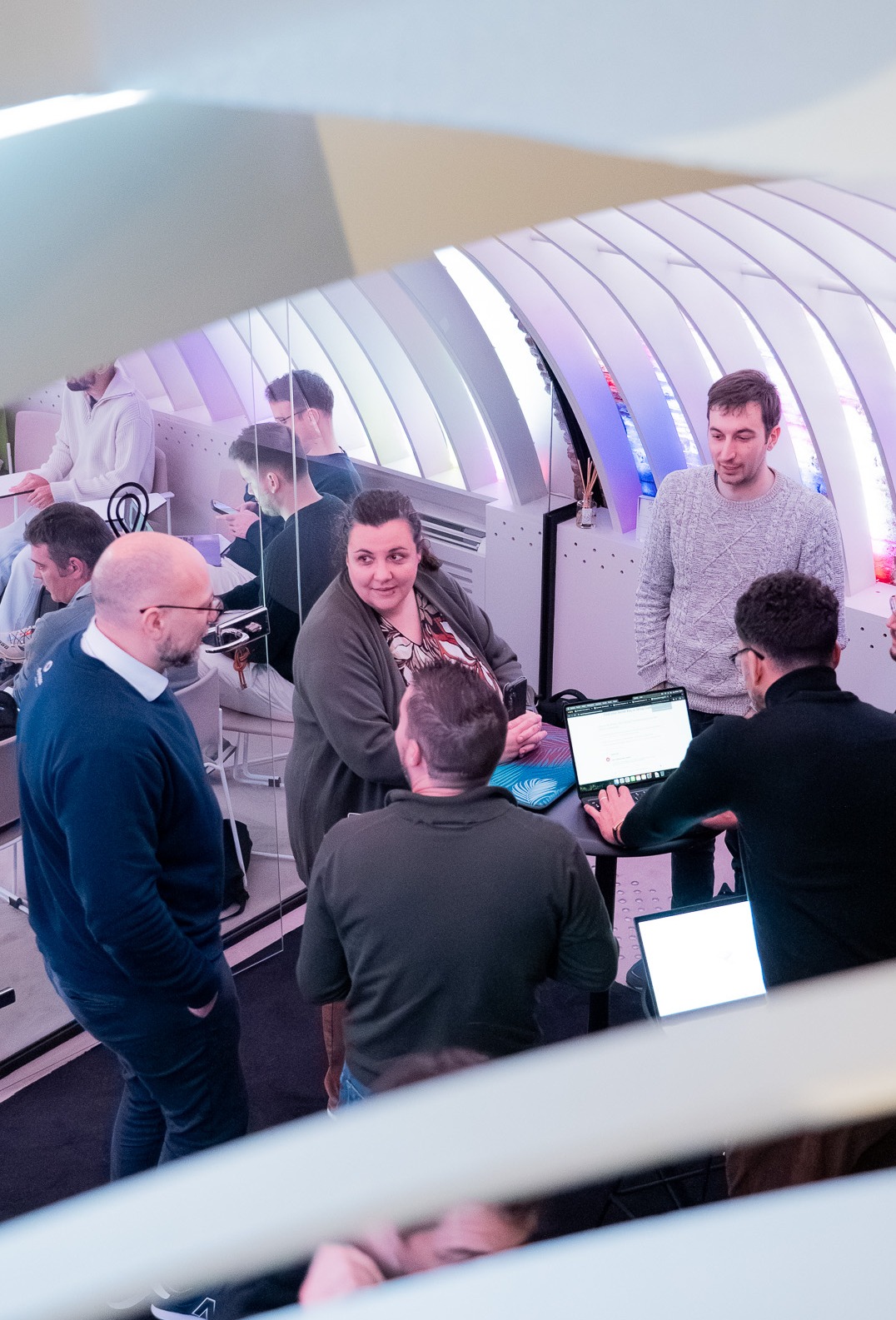 Group working on laptops at a networking event
