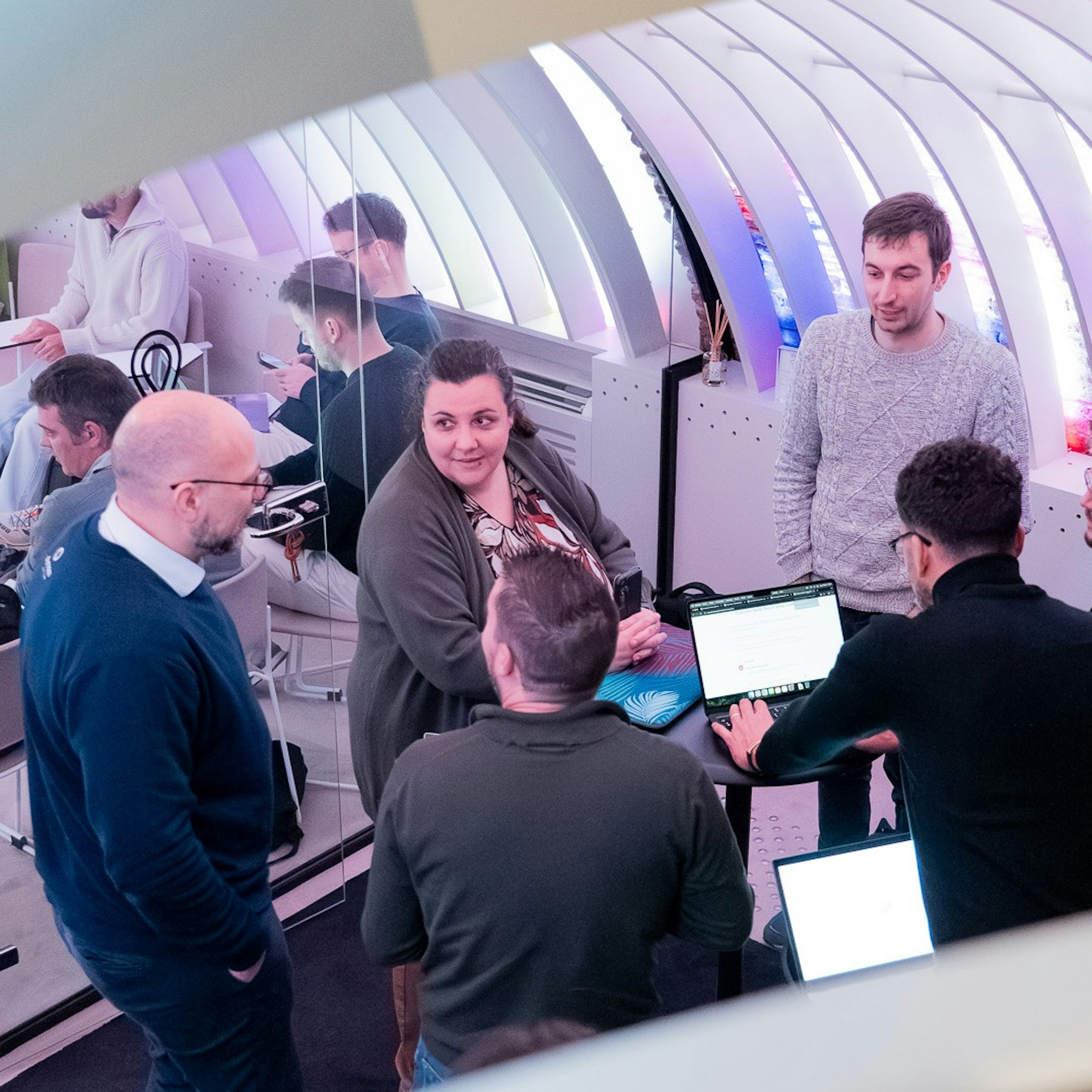 Group working on laptops at a networking event