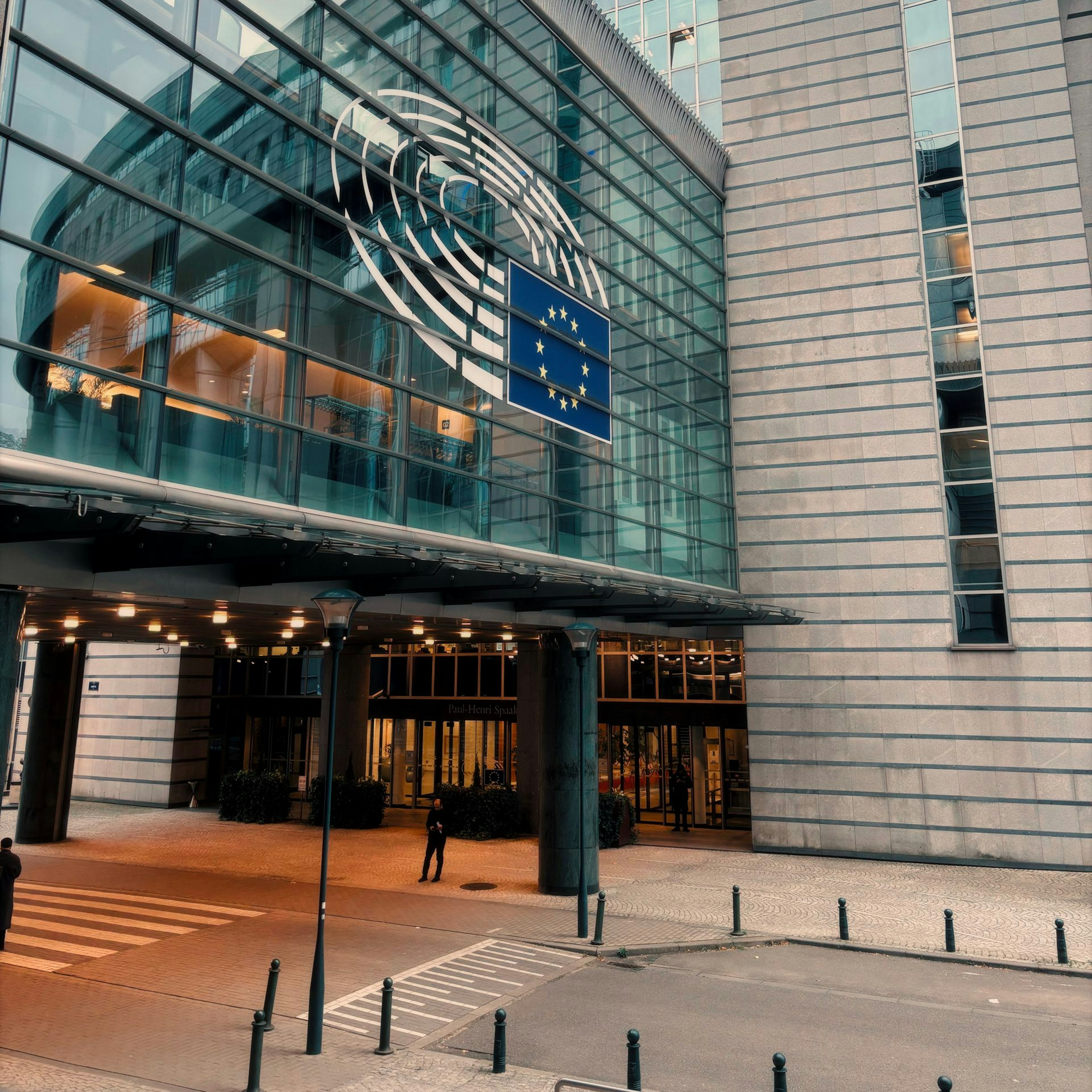 European Parliament building in Brussels with the EU flag