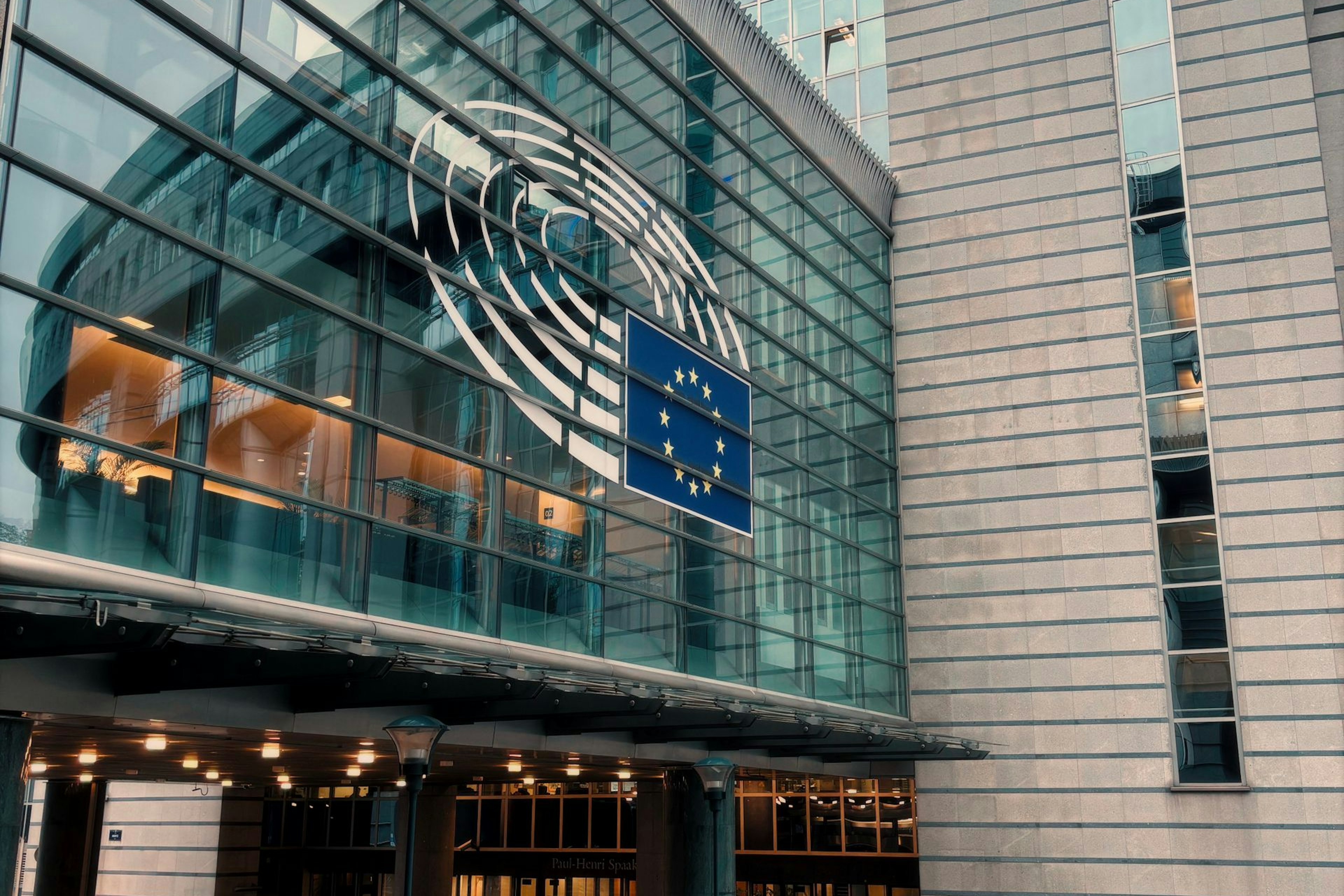 European Parliament building in Brussels with the EU flag
