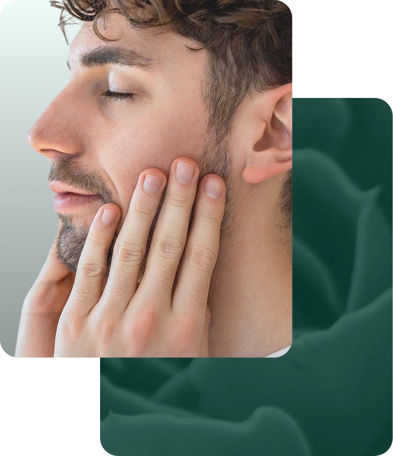 man touching face