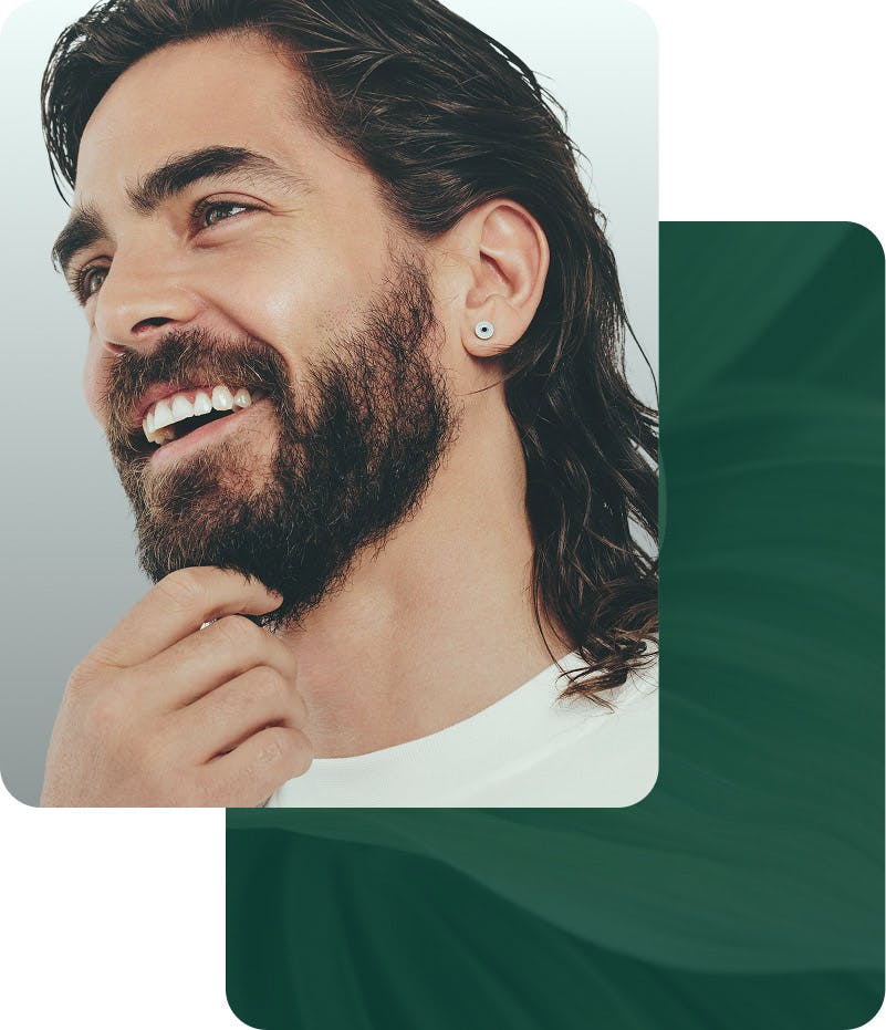 man touching beard