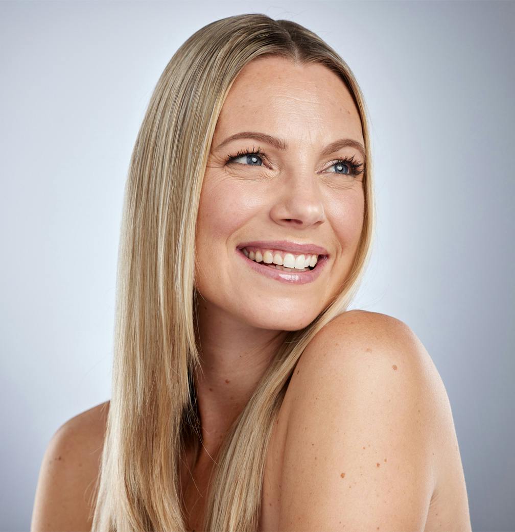 woman smiling looking to the side