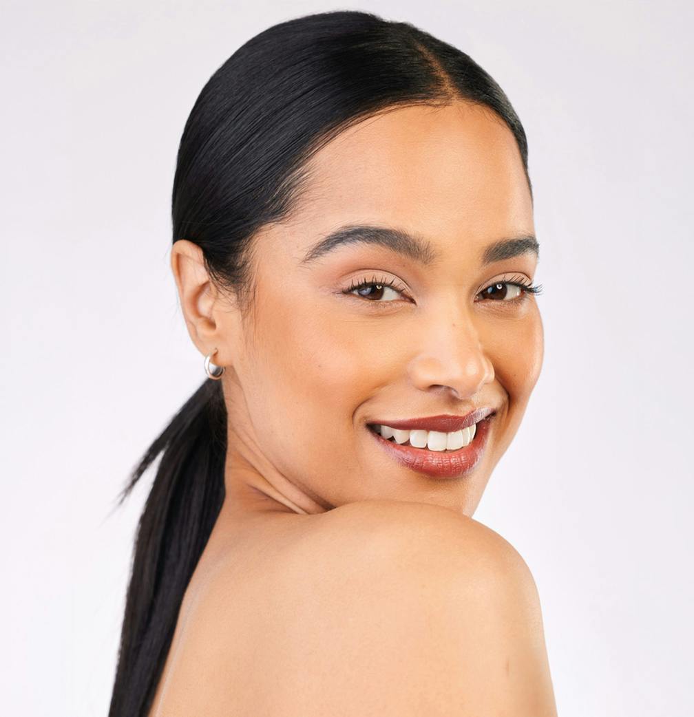 woman smiling looking over shoulder