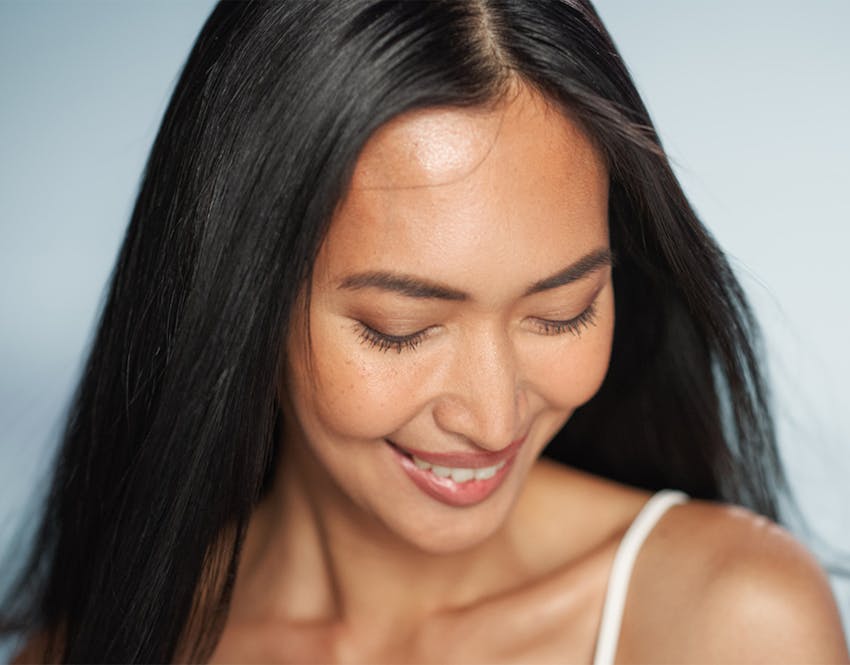 woman smiling looking down