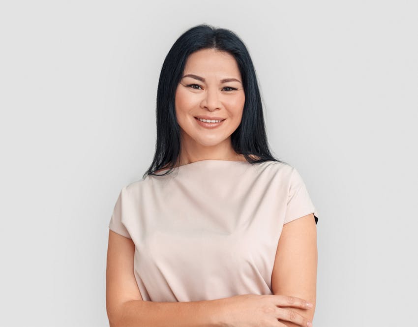 woman smiling with arms crossed