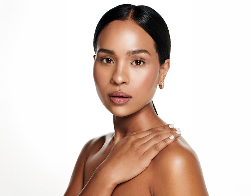 woman with one hand on shoulder