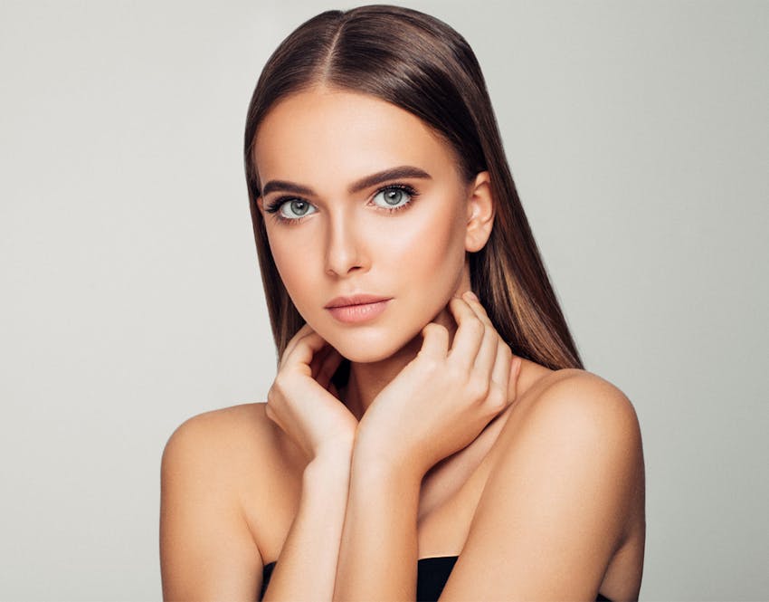 woman touching neck