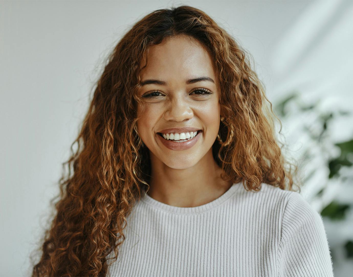 woman in white shirt smiling