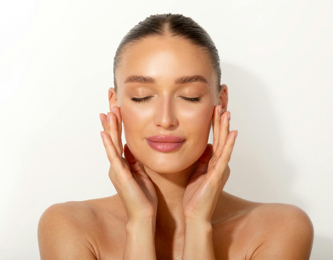 woman holding face in hands