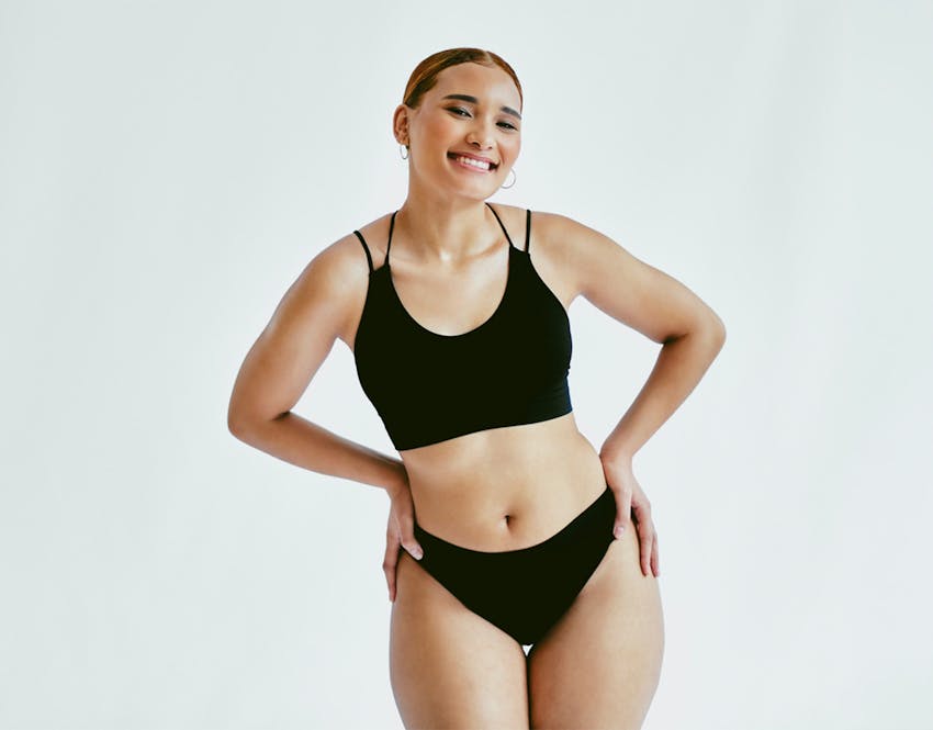 woman in swimsuit with hands on hips