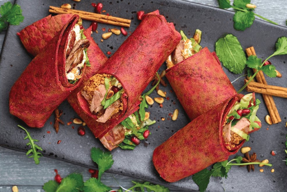 5 sliced purple beetroot wraps filled with middle eastern spiced lamb and couscous 