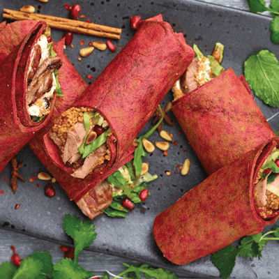 5 sliced purple beetroot wraps filled with middle eastern spiced lamb and couscous 