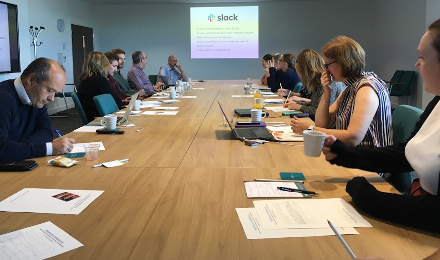 Erudus 2019 Steering Group in full swing Erudus members in a large conference room in Nottingham watching The Erudus Presentation projected onto the wall.