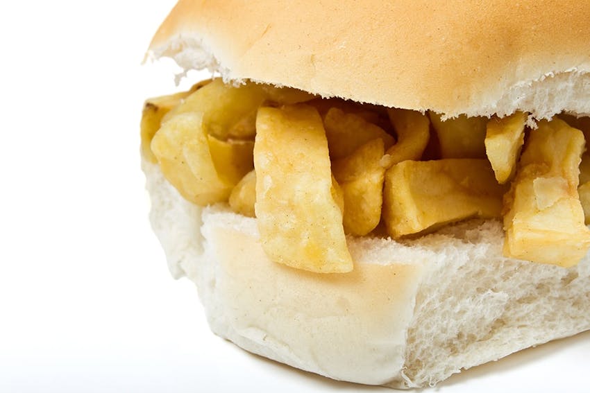 fluffy white rolled halved and filled with traditional british crunchy yet fluffy chip shop chips 