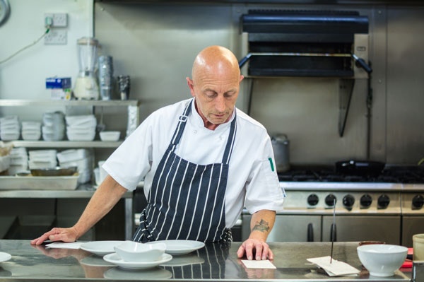 Alan, One of the Chefs at The Beresford Arms chef alan of the beresford arms in the pub kitchen reviewing menus