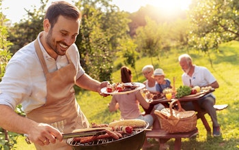 Family enjoying a BBQ Image of a family enjoying a BBQ