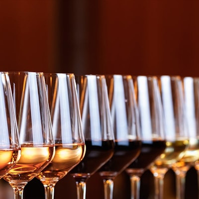 twelve wine glasses in a diagonal line 