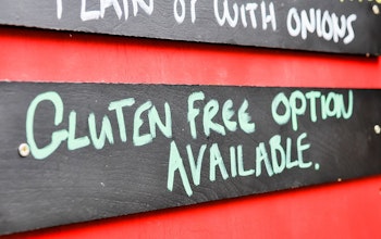 Menu board with  wooden gluten free options available sign 