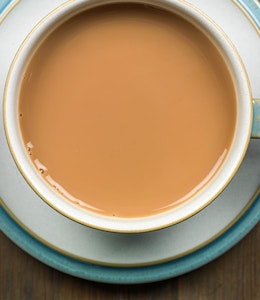birds eye view of a nice strong english breakfast tea in a blue and white cup and saucer 