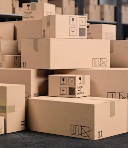 Stacked cardboard boxes in warehouse 