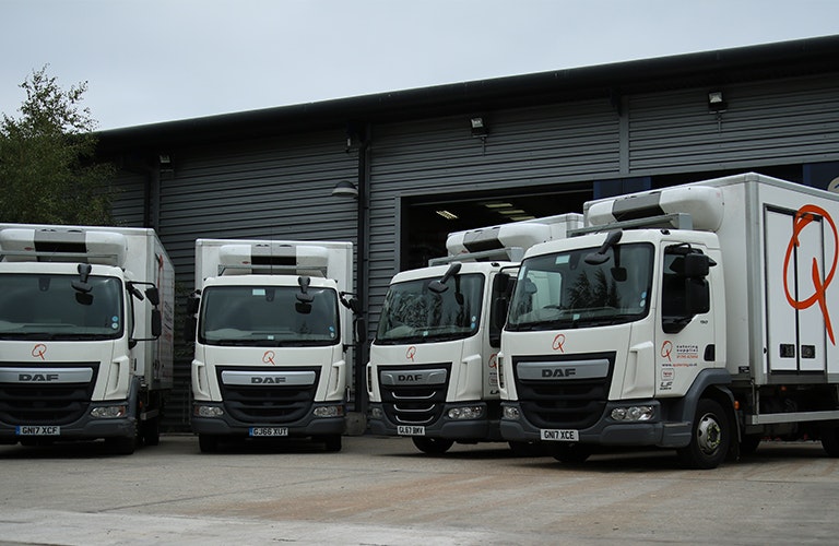 Q Catering Lorries Parked Up outside Warehouse 